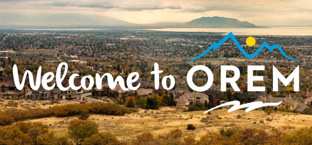 "Welcome to Orem" sign that has the view of Orem in the background.