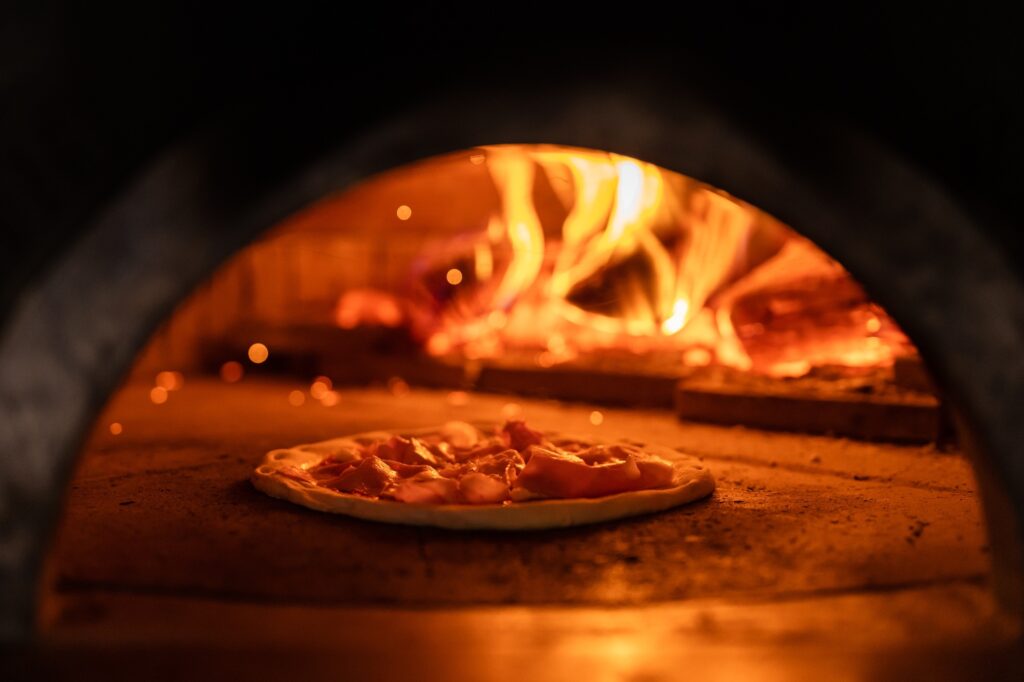 Making italian traditional pizza in the restaurant. Food concept. Cooking with traditions