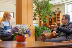 Quinn Mecham discusses city issues with Jessica Neal.