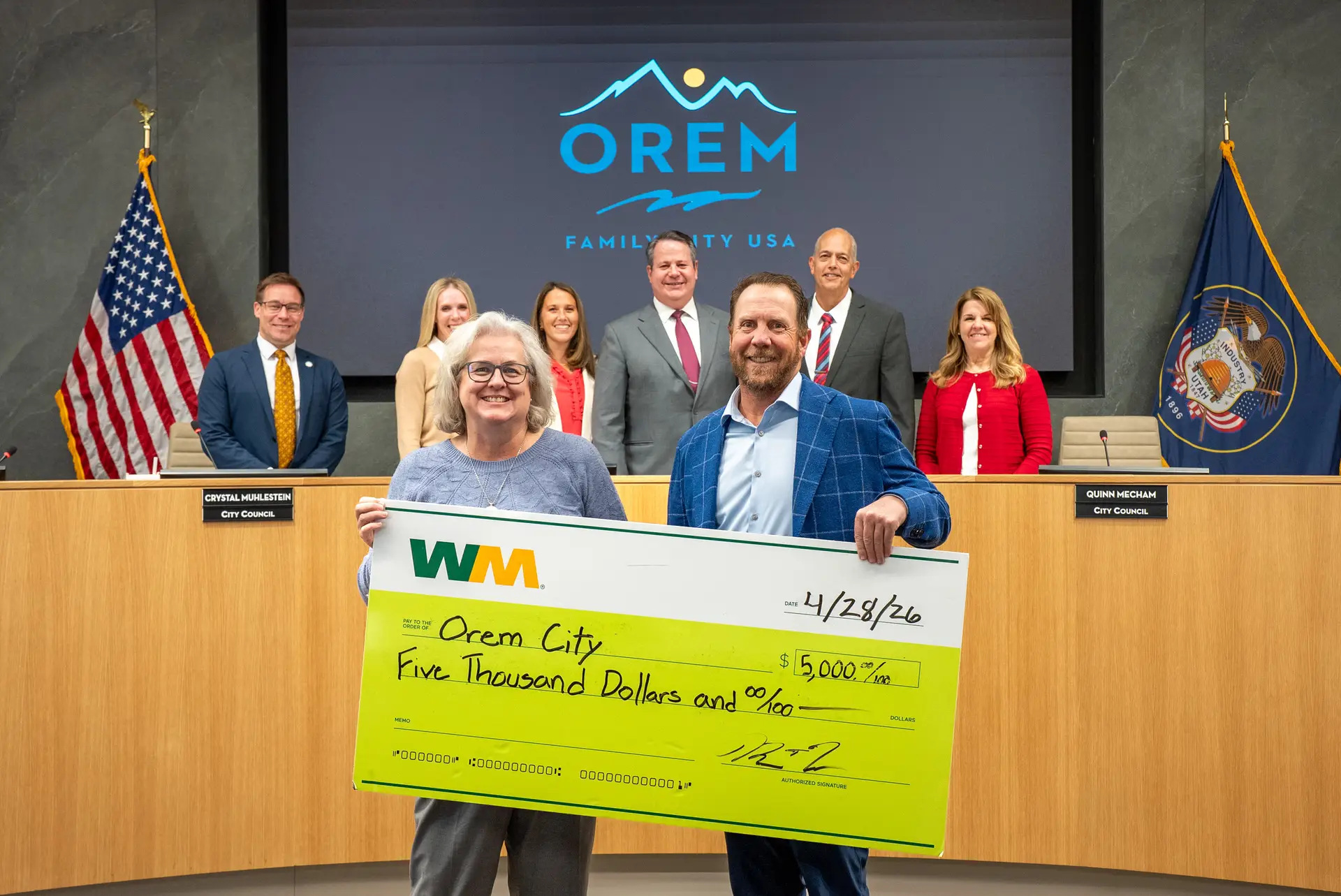 Mayor McCandless accepts a grant from WM