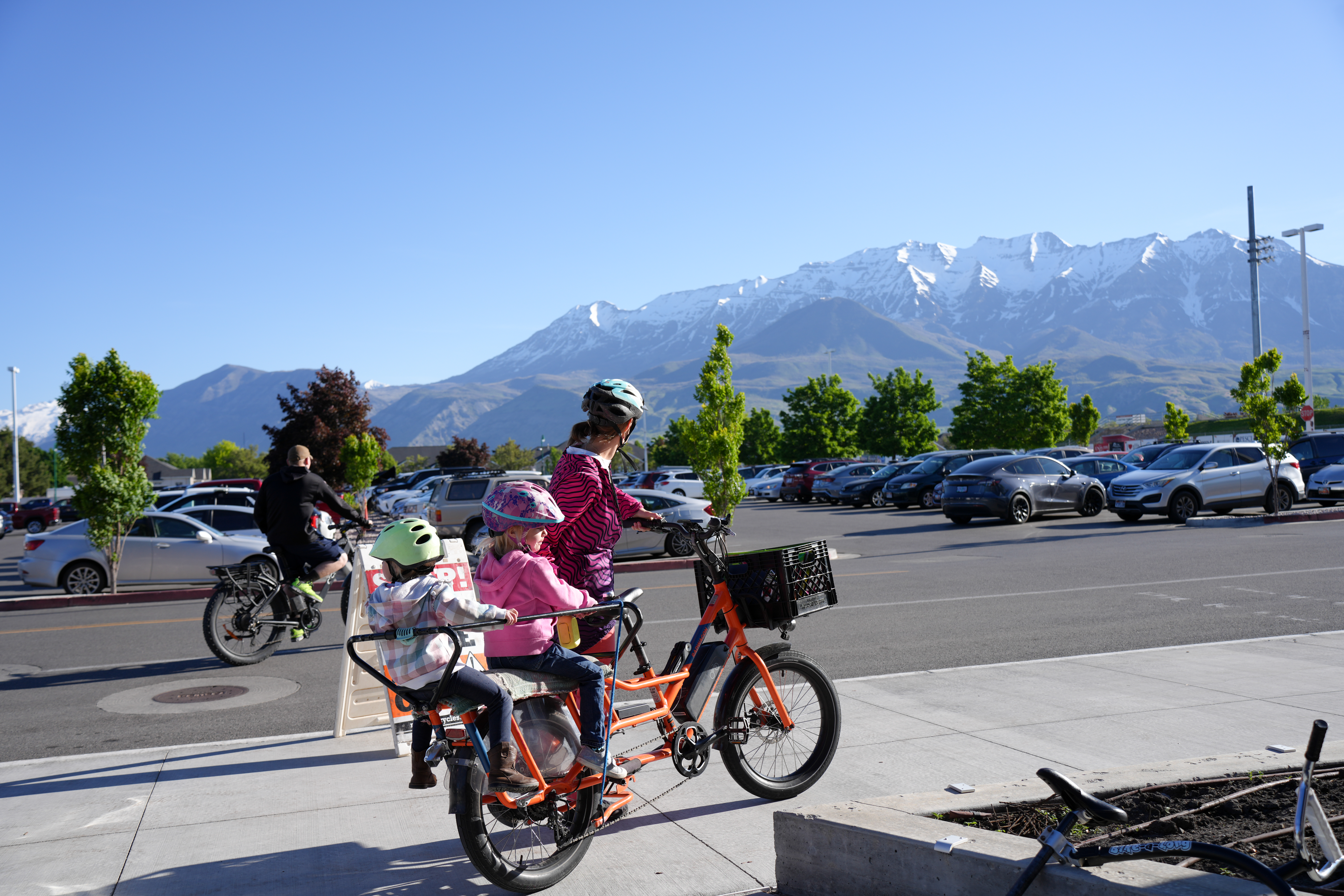 A family biking to City Center in Orem.