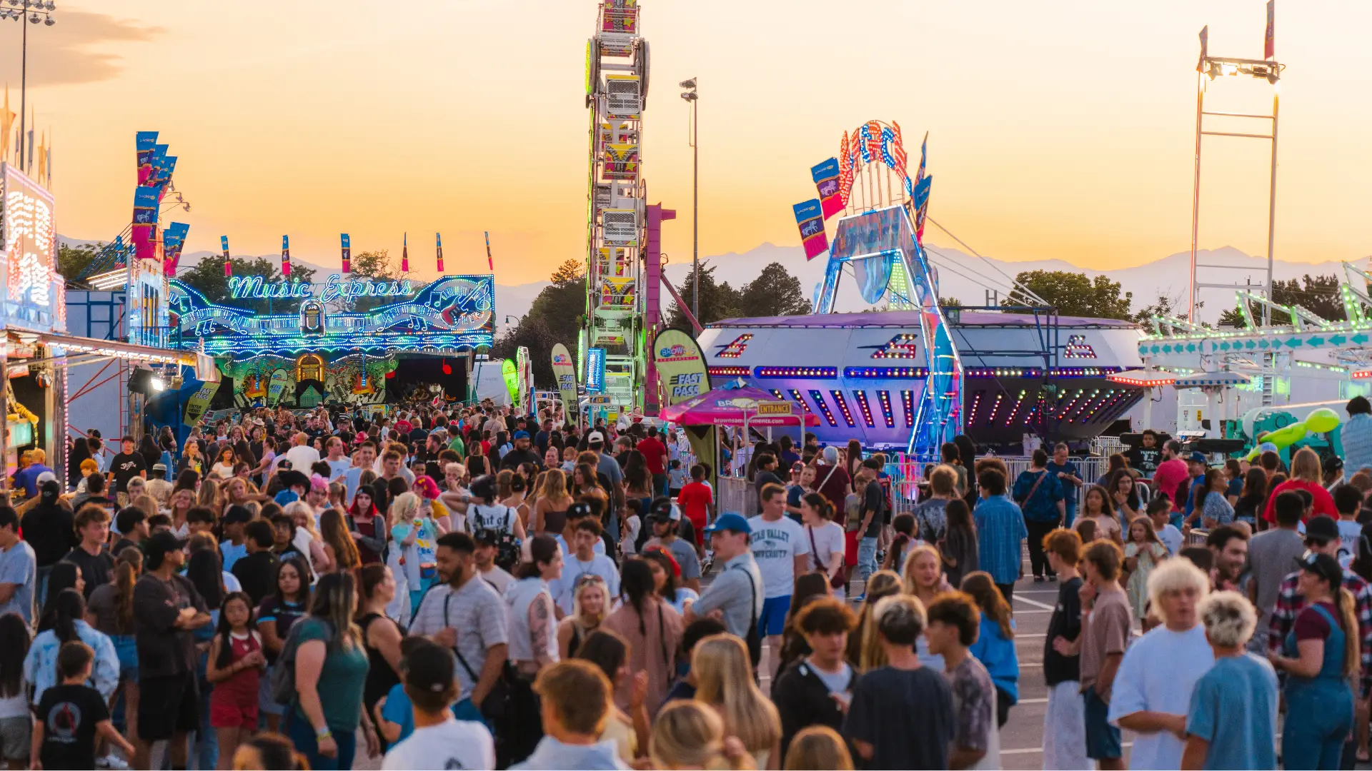 oremfest crowd at carnival at dusk