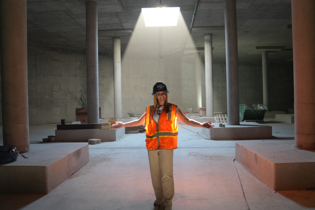 Jenn Gale inside the water tank before it is filled